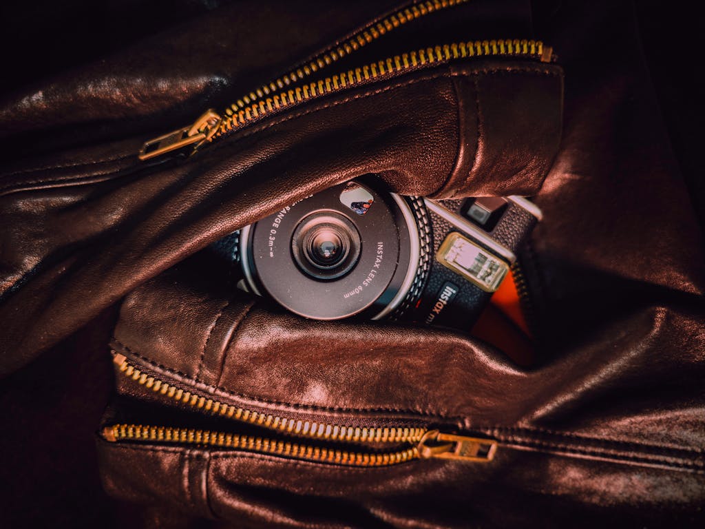 A camera is inside a leather bag